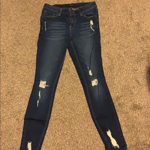 Mid wash denim jeans with rips